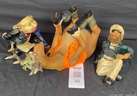 Front view of all three whimsical wine bottle holders: deer, waiter, and sailor