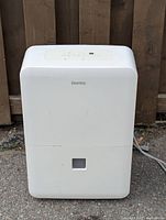 Front view of white Danby dehumidifier model DDR060BECWDB with water window and power cord.