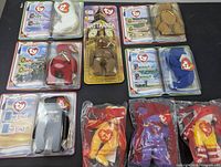 Lot of 9 Ty Teenie Beanie Babies in original packaging laid out showing front of packaging and bears