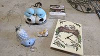 Includes all items together on floor: ceramic clock, boxed fountain maker, porcelain birds, resin bird house, ceramic chime