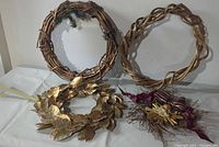 All four wreaths arranged together showing variety in style and decoration.