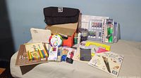 Full display of painting and drawing supplies including paper pads, brushes, paints, pencils, and instructional materials.
