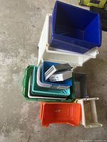 Top photos showing a stack of various plastic storage bins in multiple colors placed next to a white two-drawer plastic cart on wheels.