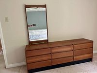 Front-left view of teak dresser with attached mirror