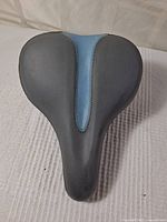 Top view of the BELL bicycle gel cushioned touring seat with black and blue padding and contoured shape.
