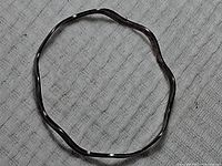 Full view of silver wavy bracelet showing shape and size.