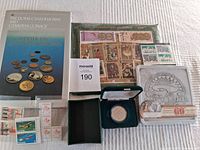 Full lot showing RCM book, stamps, coin cases, and commemorative tin