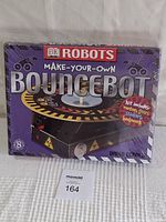 Front view of sealed DK Robots Make-Your-Own BounceBot box showing kit components included.