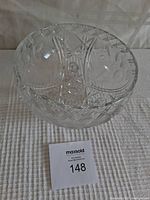 Top and side view of the clear glass decorative bowl showing etched floral and geometric diamond patterns.