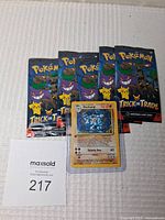 Five sealed Pokemon Trick or Trade 2024 booster packs with Machamp holographic card.