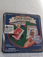 Poker-Keeno game set in original sealed packaging, showing box front with game illustration and warning labels.