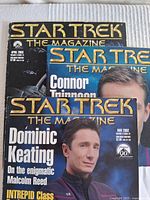 Three Star Trek The Magazine issues with visible cover art showing actors Dominic Keating, Connor Trinneer, and a Deep Space Nine themed cover.