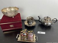 Overview of entire lot: bowl, presentation box, teapot, cup and saucer, cloisonné boxes on tray