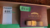 Watch and original box inside shipping carton with auction label