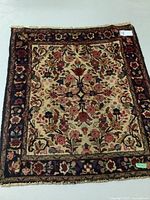 Top view of the Persian wool rug showing full floral design and border