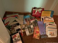 Wide view of all items together including napkins, doilies, cards, gift bag and skewers