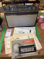 Front and top view of Nordmende Globetrotter vintage radio showing speaker grille, dials, and brand name.