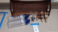 Entire lot laid out: tray, water bottles, shot glasses, stoppers