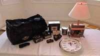 Full lot showing bag, banks, lamp, clock, can