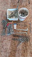 Entire lot of assorted pegboard hooks, bins and bundles