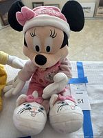 Minnie Mouse plush front view showing outfit and slippers
