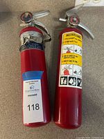 Both fire extinguishers side by side showing overall condition and size