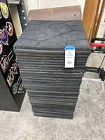 Full stack of rubber tiles on floor