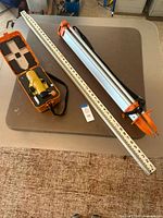 Optical level in case, measuring rod, telescoping rod collapsed