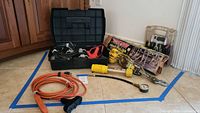 Full lot view showing hoist, charger case, cords, pressure gauge, adapter and tool caddy