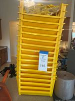 Front view of stacked yellow bins with dividers bag on top