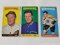 Three 1964-65 Topps tall boys hockey cards showing Billy Reay, Red Sullivan, and Ed Westfall with colorful backgrounds.