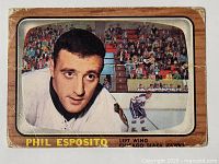Front view of the 1966-67 Topps Phil Esposito hockey card showing image of player in uniform and card wear.
