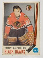 Front of the 1969-70 O-Pee-Chee Tony Esposito rookie hockey card showing the player in Chicago Black Hawks uniform with goalie gear, number 35, and team logo.