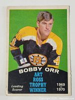 Front of the 1970-71 O-Pee-Chee Bobby Orr Art Ross Trophy Winner hockey card, showing Bobby Orr in Boston Bruins jersey with green background and text about his trophies.