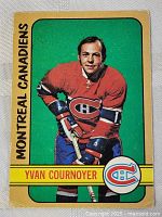Front of vintage 1972-73 O-Pee-Chee Yvan Cournoyer hockey card showing player photo in Montreal Canadiens uniform with green and yellow border.