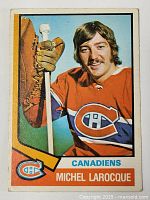 Front of 1974-75 O-Pee-Chee Michel Larocque rookie card with player photo and Canadiens logo.