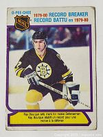 Front of 1980-81 O-Pee-Chee NHL Record Breaker rookie card featuring Ray Bourque in Boston Bruins uniform with NHL logo and card details.