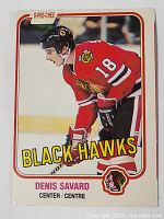 Front of the Denis Savard rookie hockey card showing player in Black Hawks red jersey number 18, with team and player name.