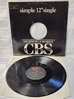 Photo of the vinyl record outside its sleeve showing the CBS label on the record surface with a visible catalogue information.
