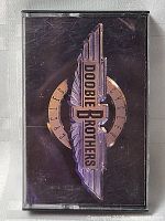 Front of cassette case showing Doobie Brothers logo and Cycles album artwork