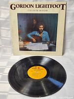 Vinyl LP record from Gordon Lightfoot Cold On The Shoulder with yellow label, showing disc condition.