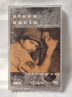 Front cover of cassette tape with sepia photograph of Steve Earle and album title.
