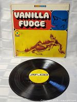 Front view of the LP cover and vinyl record showing label and surface condition