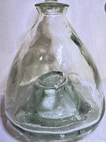 Front view of the vintage glass fly/wasp catcher showing its conical shape and internal funnel for trapping.