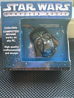 Front view of original box showing Star Wars logo, Darth Vader computer mouse through window, and promotional text.