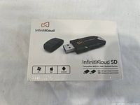 Front of InfinitKloud box showing the adapter with USB Type-C plug and compatibility icons for PC, Mac, and Android devices.