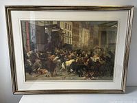 Photo of framed art print showing numerous bulls and bears in front of city buildings, titled "Bulls and Bears in the Market."