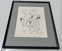 Full front view of framed print under glass showing black metal frame and grey mat