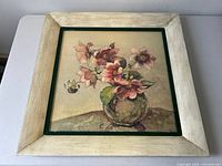 Front view of framed art print on white surface