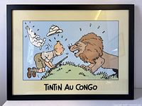 Straight-on front view of framed print showing Tintin and lion scene